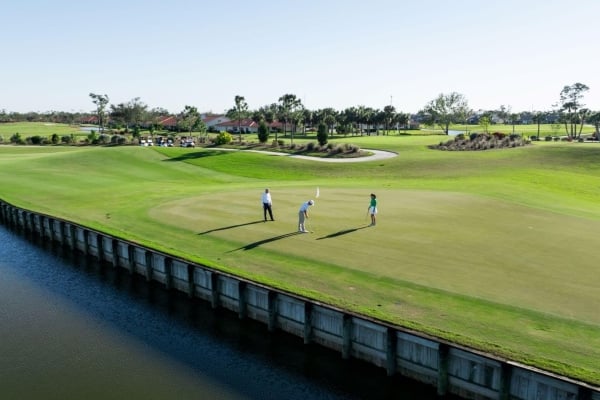 Golfers on the green at Aileron Golf course