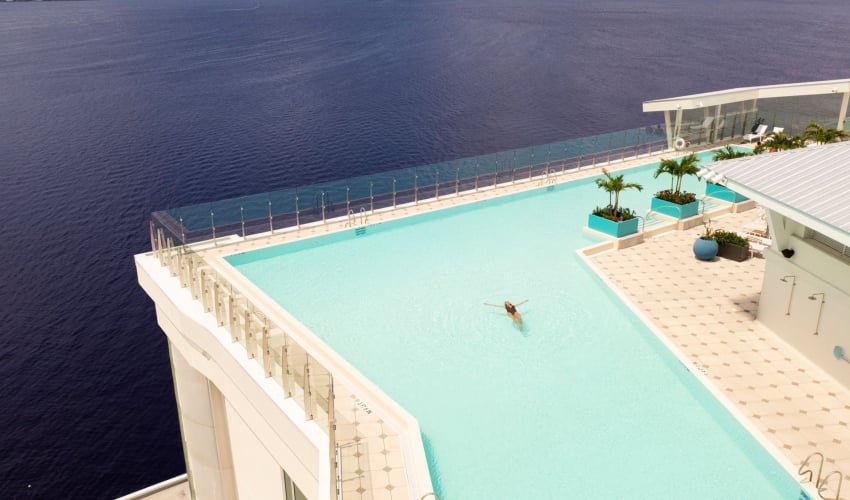 Aerial view of woman in the pool at Level blue Rooftop at Sunseeker Resort