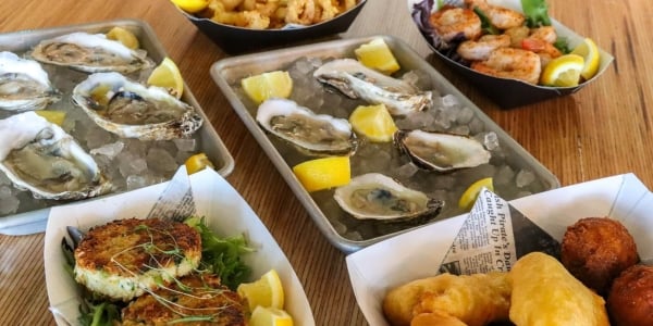 Variety of seafood such as oysters, crab cakes, calamari, shrimp and more at Kinderhook at Sunseeker Resort