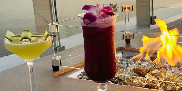 Cocktails next to fire pit at Level Blue