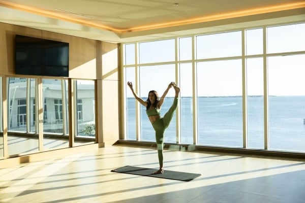 Woman doing yoga in the fitness center at Sunseeker Resort