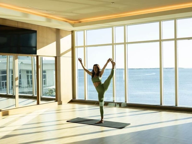 Woman doing yoga in the fitness center at Sunseeker Resort