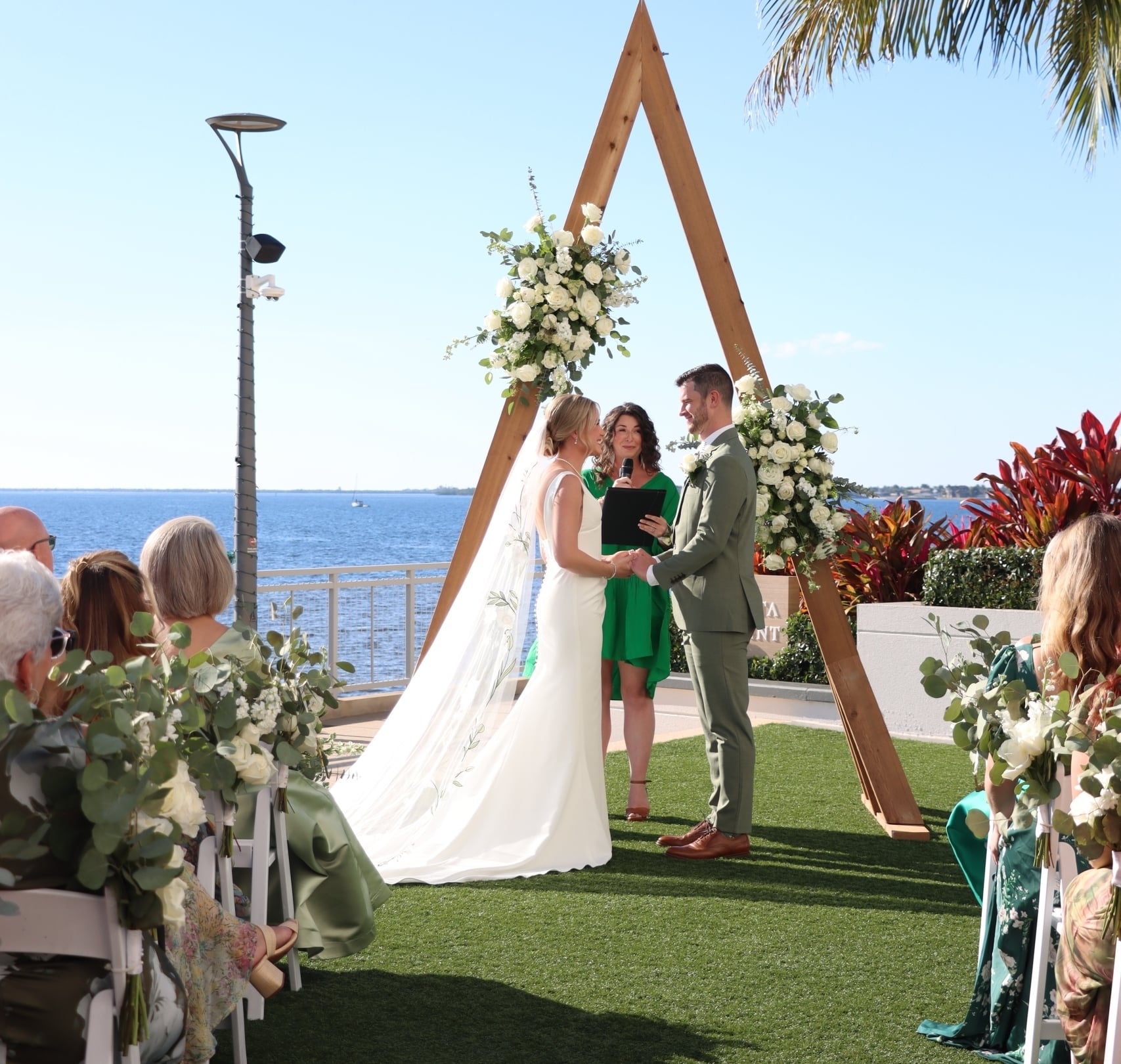 Bride and groom on Charlotte Harbor wedding lawn on the waterfront